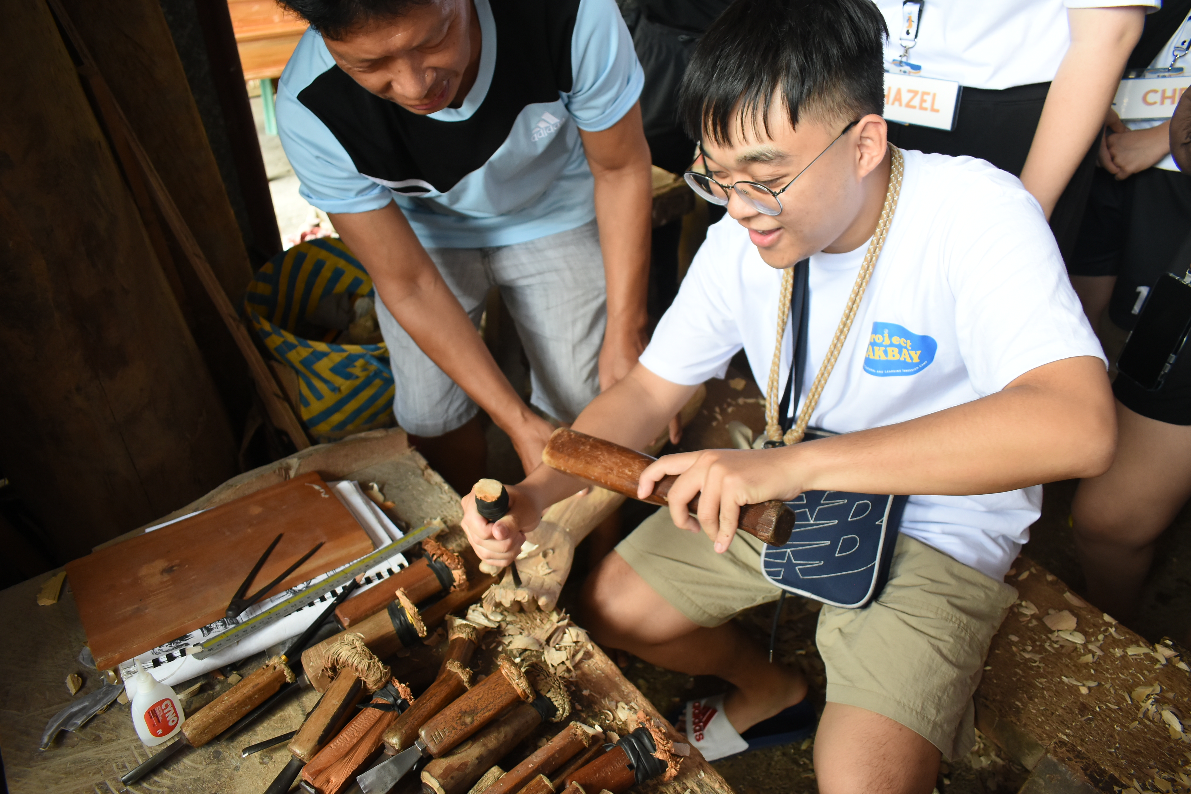 Hands weaving traditional fabric